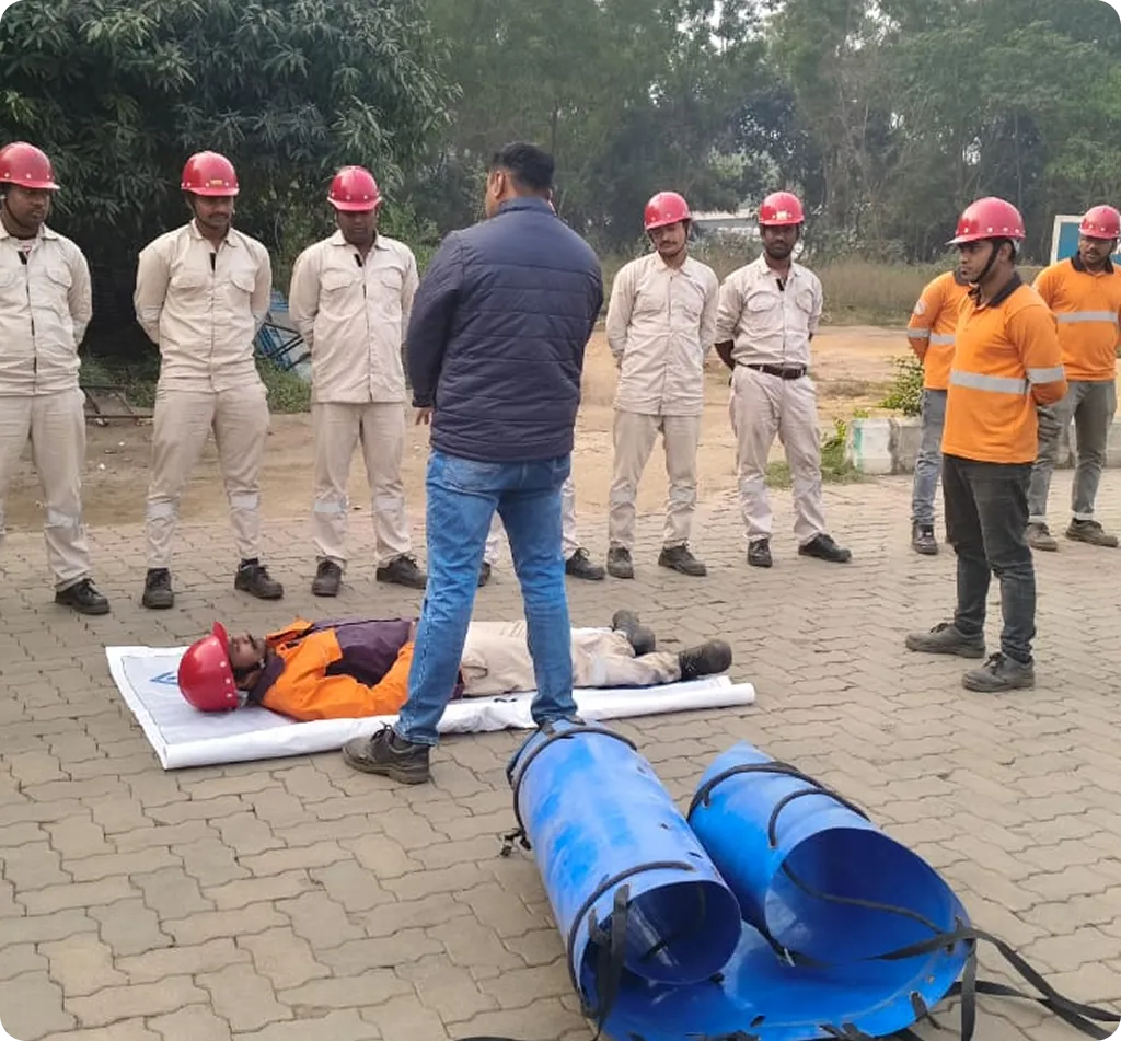 Safety Technicians - Two safety professionals working with industrial control panel in PPE